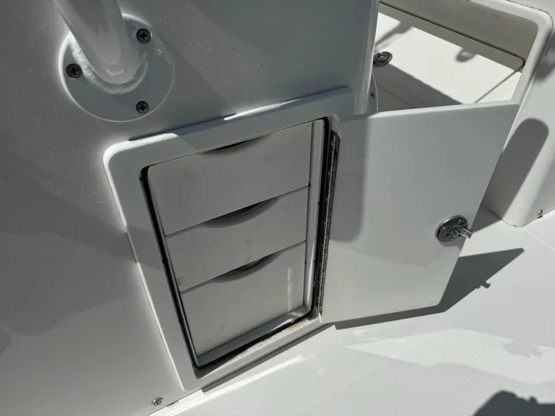 Slide: The Image of Open storage compartment on 2009 Regulator 32 Forward Seating boat. - 21