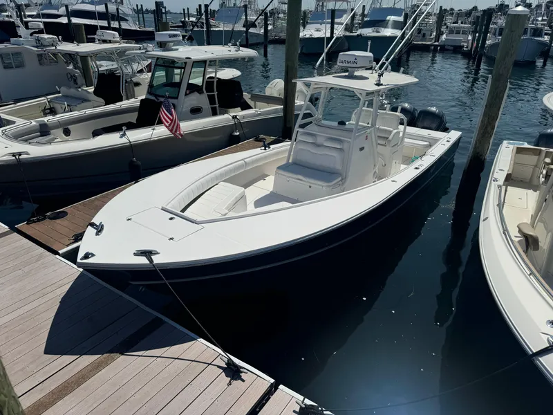 Slide: The Image of 2009 Regulator 32 Forward Seating boat docked at marina. - 29