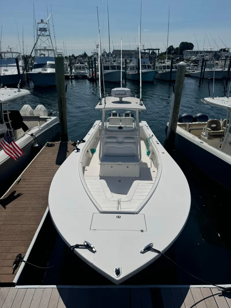 Slide: The Image of 2009 Regulator 32 Forward Seating boat docked in marina. - 30
