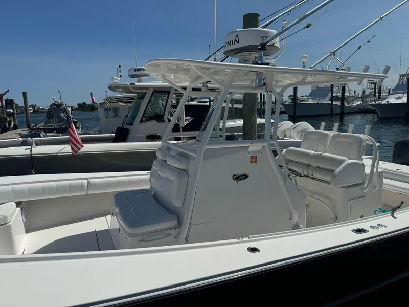 Slide: The Image of 2009 Regulator 32 Forward Seating boat docked at marina. - 33