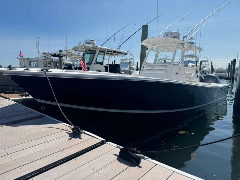 Slide: The Image of 2009 Regulator 32 Forward Seating boat docked at marina. - 39