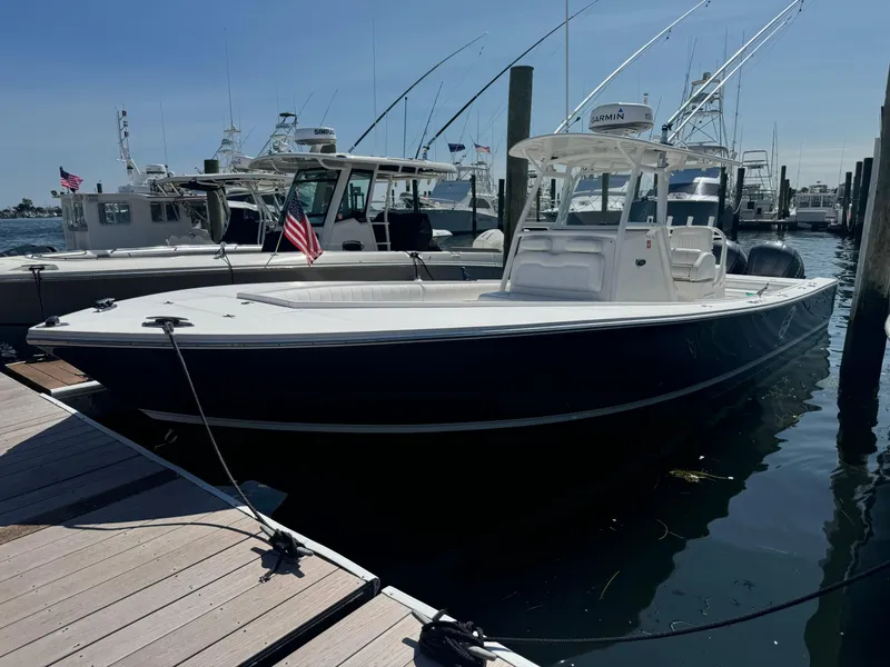 Slide: The Image of 2009 Regulator 32 Forward Seating boat docked at marina. - 40