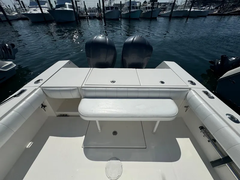 Slide: The Image of 2009 Regulator 32 Forward Seating boat with twin engines, docked in a marina. - 41