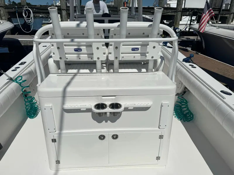 Slide: The Image of 2009 Regulator 32 Forward Seating boat with rod holders and storage compartments. - 45