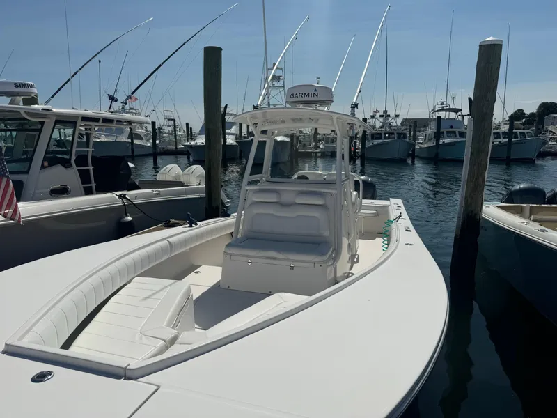 Slide: The Image of 2009 Regulator 32 Forward Seating boat docked at marina. - 6
