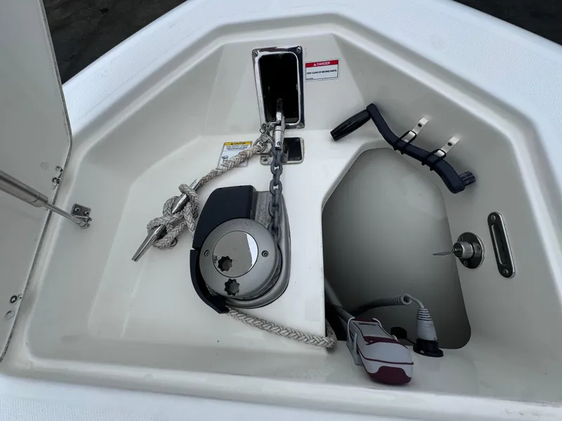Slide: The Image of Anchor storage compartment on a 2022 Boston Whaler 330 Outrage boat. - 24