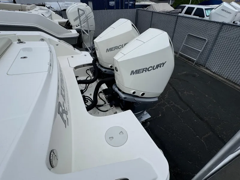 Slide: The Image of 2022 Boston Whaler 330 Outrage with dual Mercury outboard engines. - 5