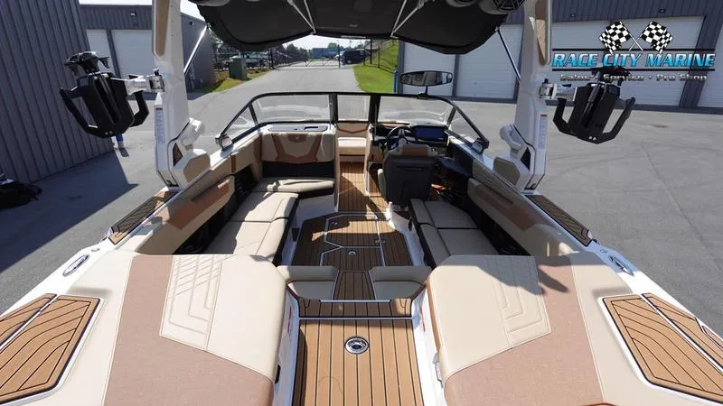 Slide: The Image of 2022 Nautique Super Air Nautique G23 interior with luxurious seating and modern design. - 11