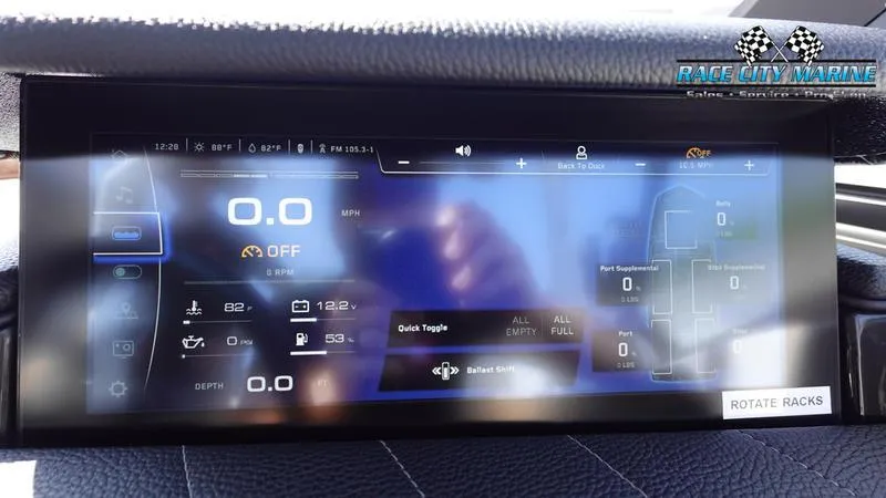 Slide: The Image of 2022 Nautique Super Air Nautique G23 dashboard display with digital controls and navigation. - 38