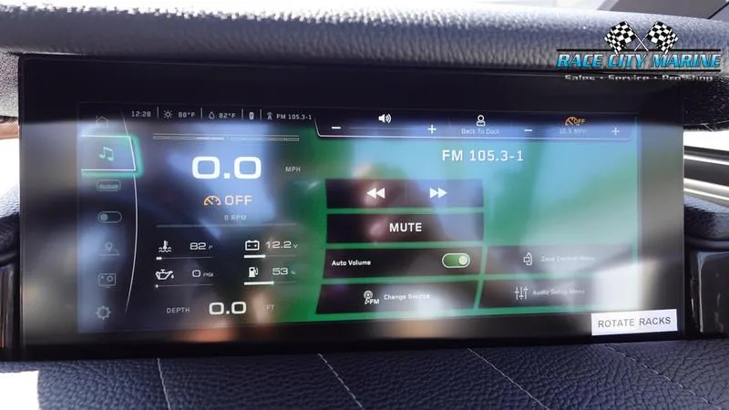 Slide: The Image of 2022 Nautique Super Air Nautique G23 dashboard display with controls and FM radio settings. - 39