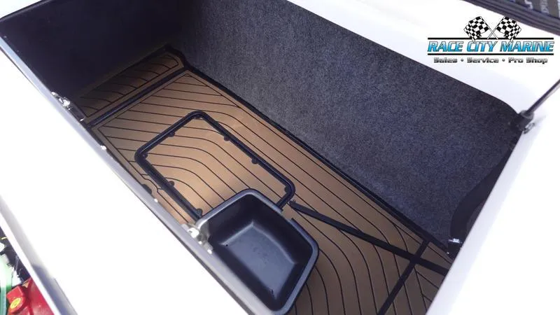 Slide: The Image of 2022 Nautique Super Air Nautique G23 storage compartment with Race City Marine logo. - 42