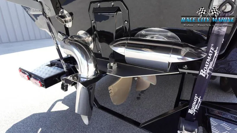 Slide: The Image of 2022 Nautique Super Air Nautique G23 boat stern with propeller and exhaust system. - 8
