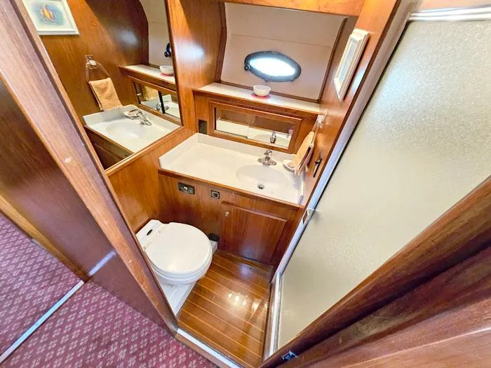 Slide: The Image of Bathroom interior of 1993 Navigator 4300 yacht with wood accents and modern fixtures. - 26