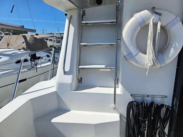 Slide: The Image of Staircase and lifebuoy on 1993 Navigator 4300 yacht deck. - 28