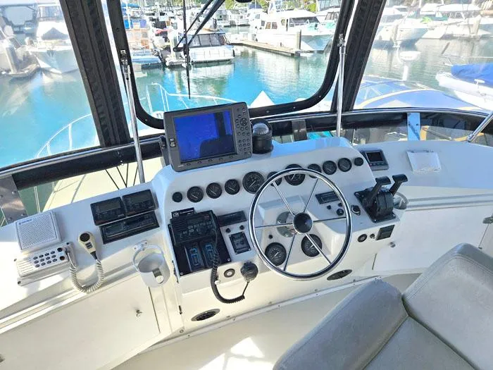 Slide: The Image of Cockpit of 1993 Navigator 4300 yacht with steering wheel and navigation equipment. - 32