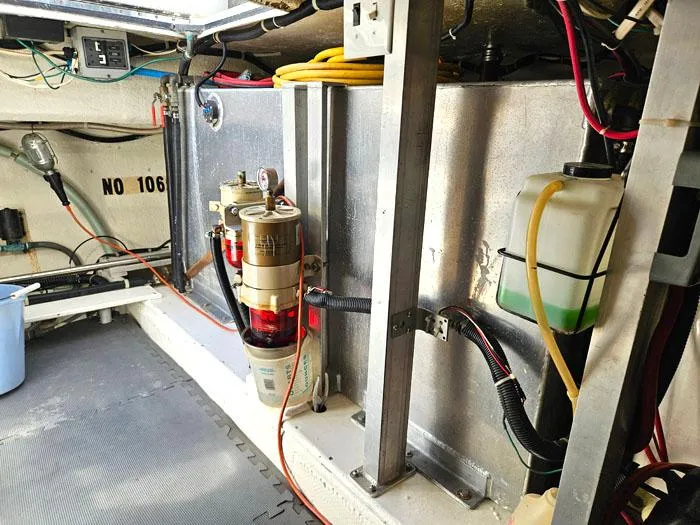 Slide: The Image of Engine room of 1993 Navigator 4300 with fuel filter and wiring. - 38