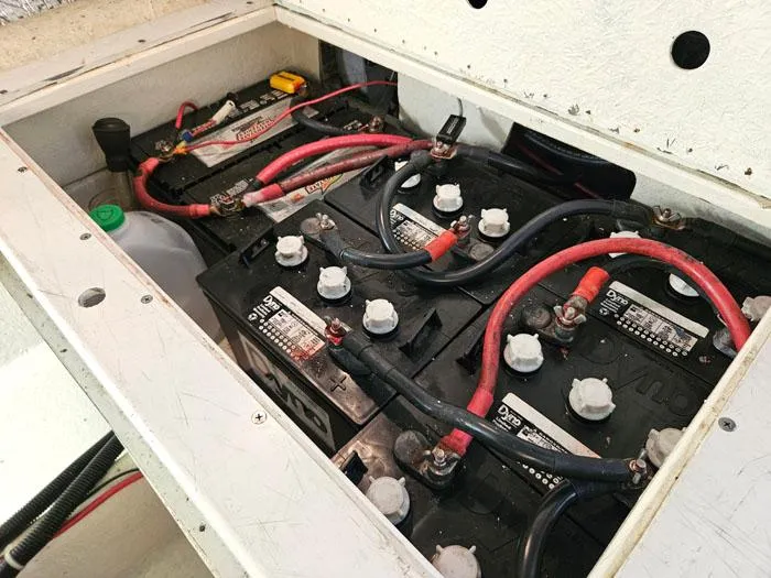 Slide: The Image of Battery compartment of a 1993 Navigator 4300 with multiple connected batteries and cables. - 39