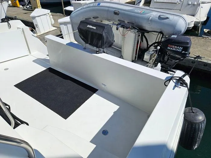 Slide: The Image of 1993 Navigator 4300 boat with inflatable dinghy and Nissan Marine outboard motor. - 4