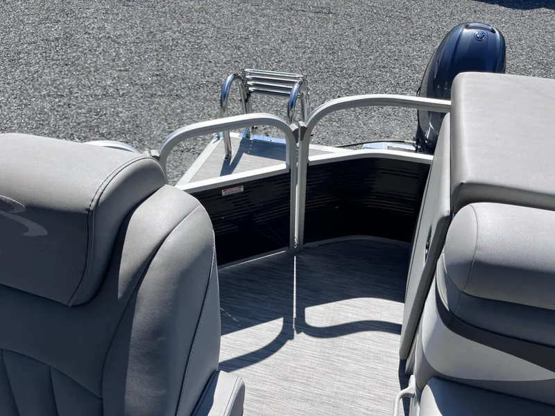 Slide: The Image of 2021 Bennington SV 20 Quad Bench interior with gray seating and rear ladder. - 12