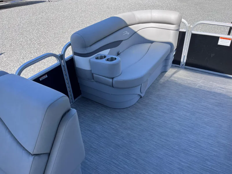Slide: The Image of 2021 Bennington SV 20 Quad Bench with gray seating and cup holders on a boat deck. - 17
