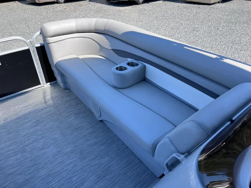 Slide: The Image of 2021 Bennington SV 20 Quad Bench with gray seating and cup holders on a boat deck. - 18