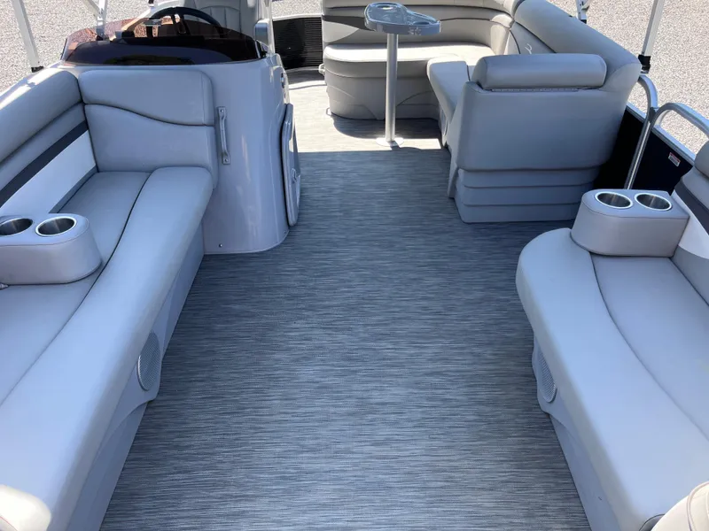 Slide: The Image of 2021 Bennington SV 20 Quad Bench interior with gray seating and cup holders. - 5