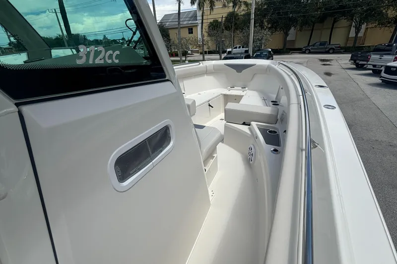 Slide: The Image of 2025 Sailfish 312 CC boat interior, showcasing sleek design and spacious seating. - 16
