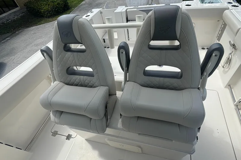 Slide: The Image of 2025 Sailfish 312 CC boat seats, featuring sleek gray design and modern comfort. - 21