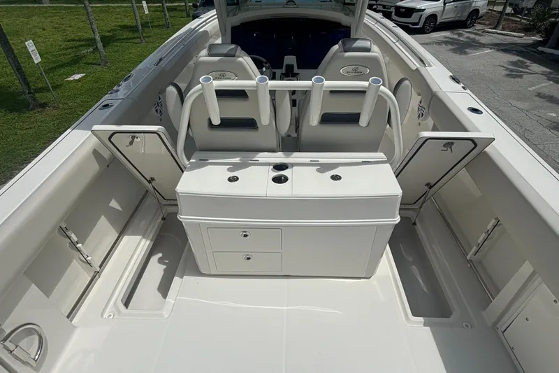 Slide: The Image of 2025 Sailfish 312 CC boat interior with seating and storage compartments. - 28