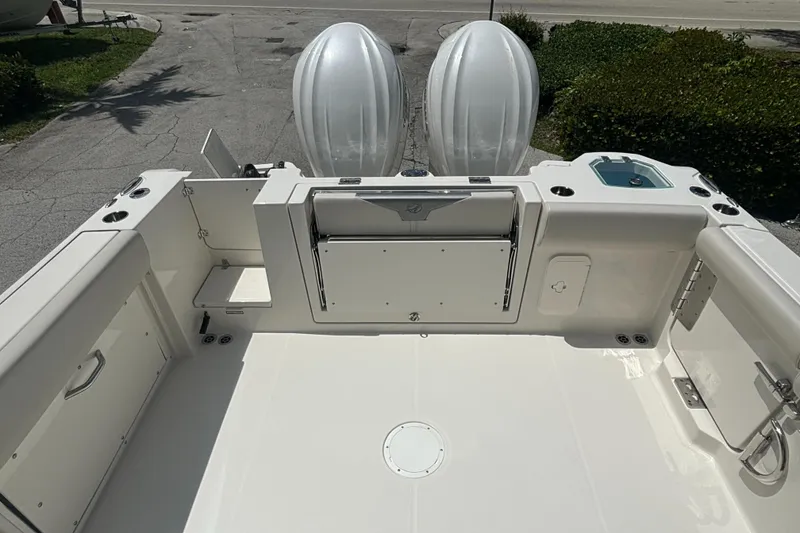 Slide: The Image of 2025 Sailfish 312 CC boat deck with dual engines, spacious layout, and sleek design. - 29