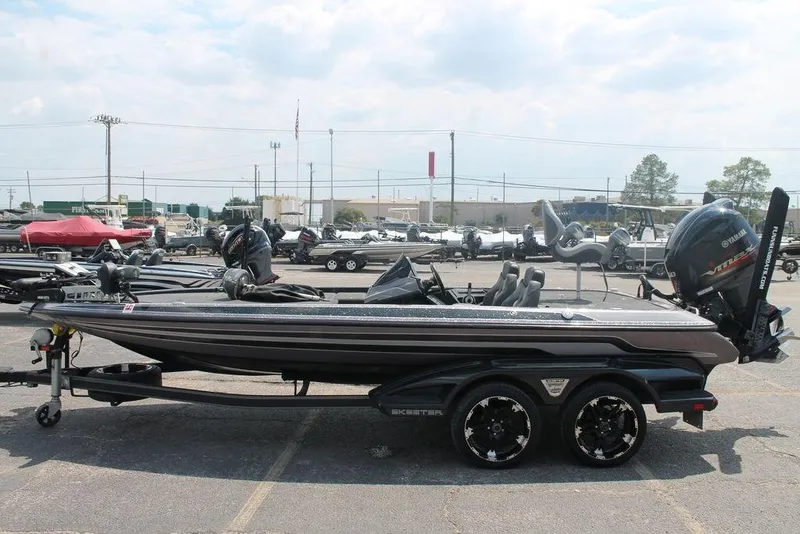 Slide: The Image of 2018 Skeeter FX20 Limited Edition boat on trailer in outdoor lot. - 13