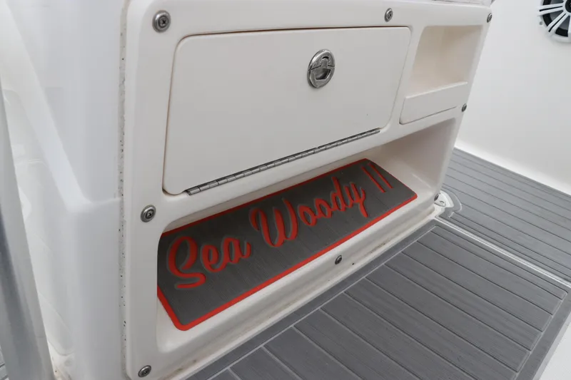 Slide: The Image of 2018 Robalo R202 Explorer boat storage compartment with "Sea Woody" mat. - 6