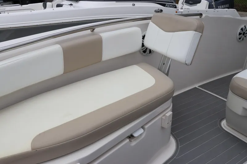 Slide: The Image of 2018 Robalo R202 Explorer boat interior with beige and white seating. - 9