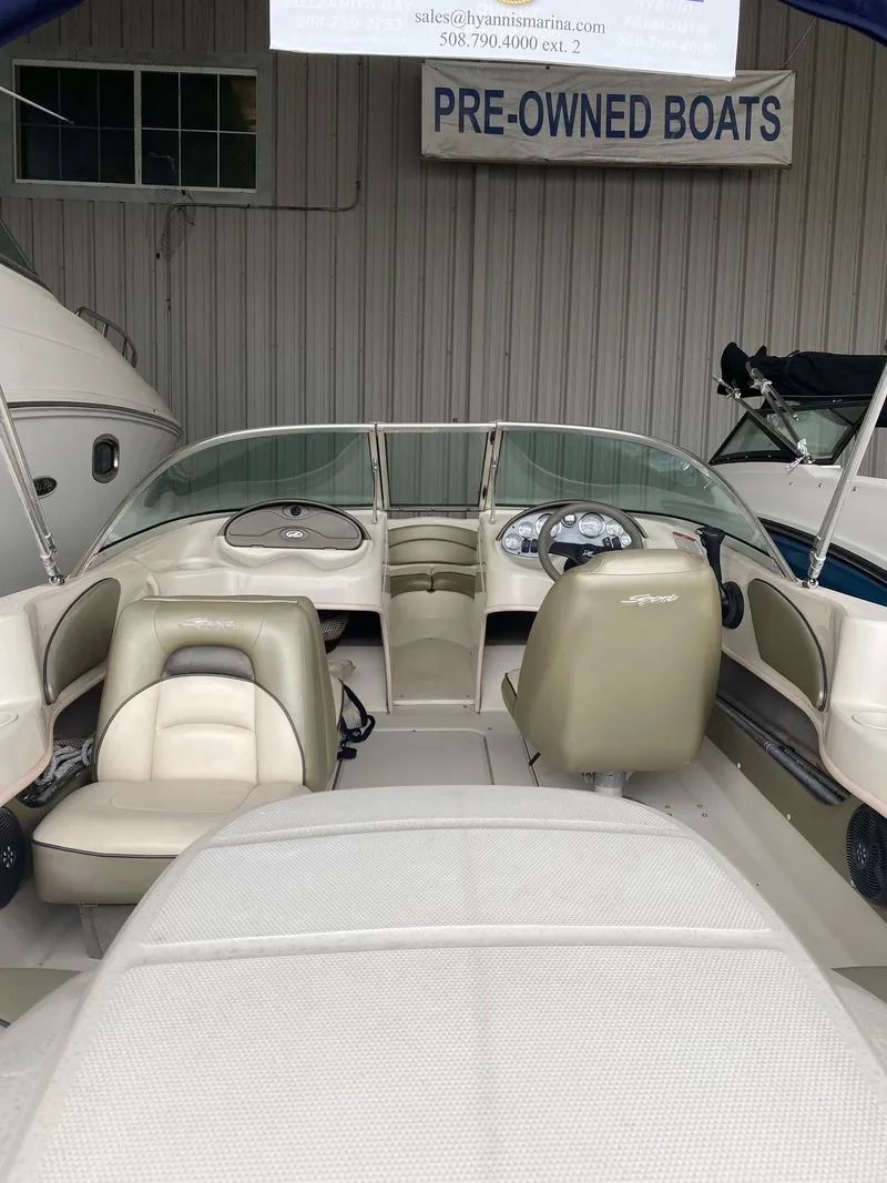 Slide: The Image of 2005 Sea Ray 180 Sport boat interior at pre-owned dealership. - 8