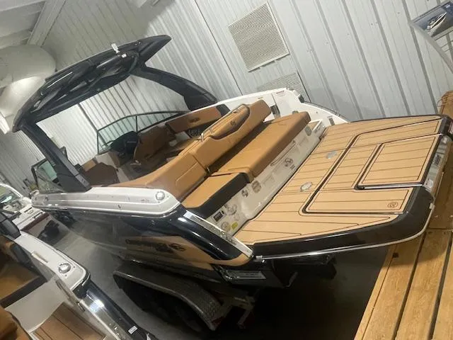 Slide: The Image of 2025 Chaparral 30 Surf boat with sleek design and spacious seating. - 6