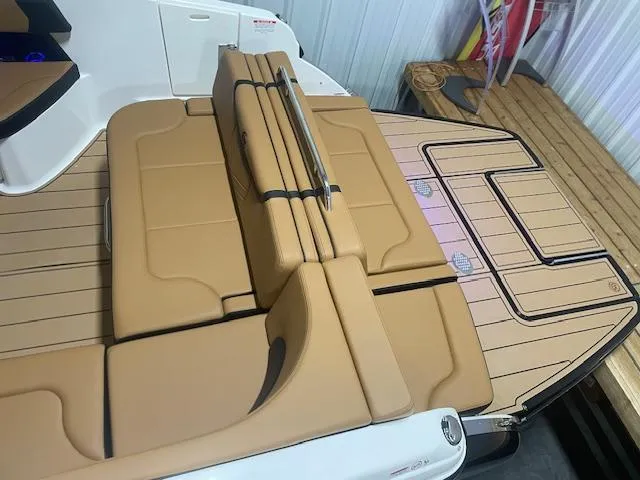 Slide: The Image of 2025 Chaparral 30 Surf boat with tan seating and deck. - 9