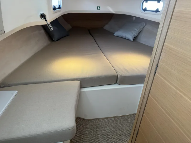 Slide: The Image of 2024 Nimbus Commuter 9 cabin interior with cozy bedding and modern design. - 5