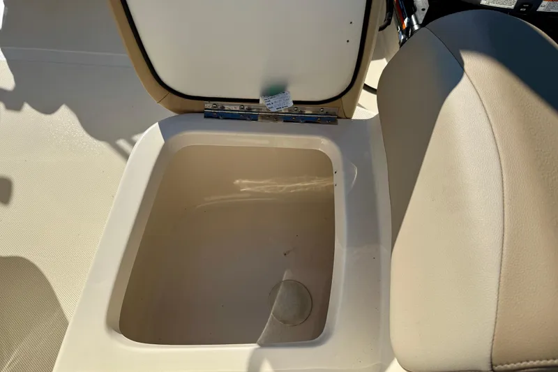 Slide: The Image of Open storage compartment in 2024 Scout 175 Sport Dorado boat interior. - 14