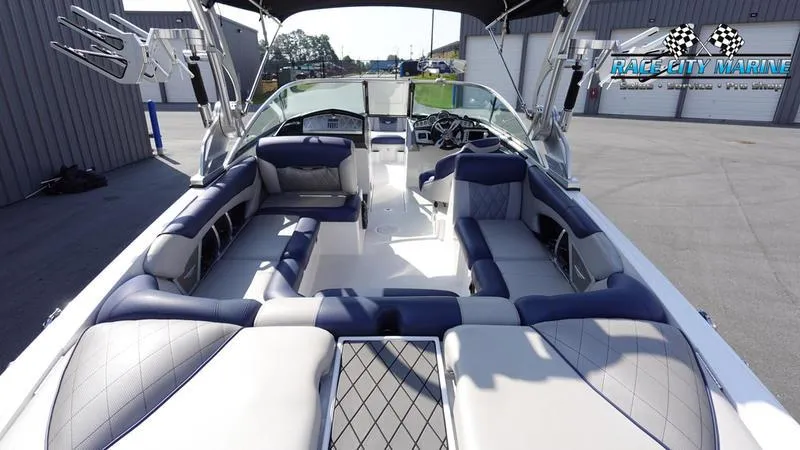 Slide: The Image of 2015 MasterCraft X55 boat interior with luxurious seating and modern design. - 12