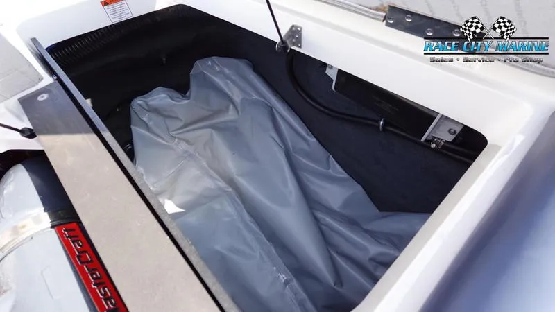 Slide: The Image of Open storage compartment in 2015 MasterCraft X55 boat. - 15