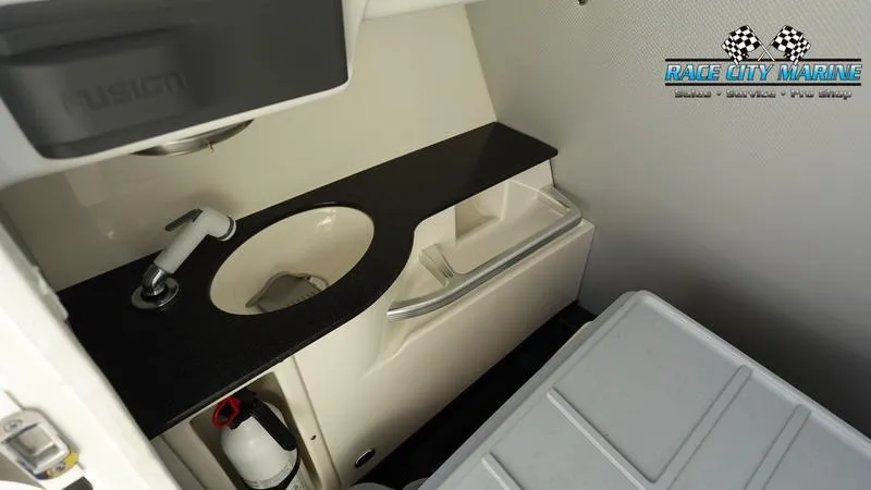 Slide: The Image of 2015 MasterCraft X55 boat interior with sink and storage area. - 17