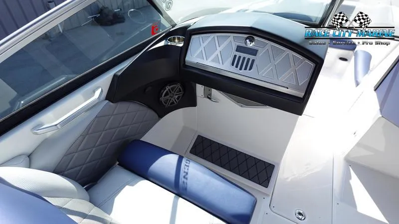 Slide: The Image of Interior of 2015 MasterCraft X55 boat with quilted seats and modern dashboard. - 19