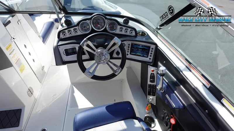 Slide: The Image of 2015 MasterCraft X55 boat dashboard with steering wheel and control panel. - 20