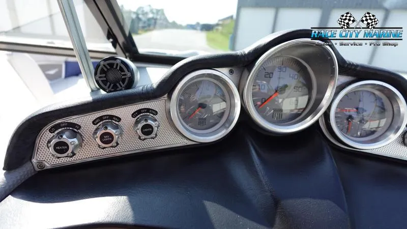 Slide: The Image of Dashboard of a 2015 MasterCraft X55 boat with gauges and controls. - 24
