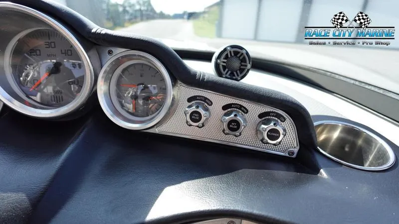 Slide: The Image of Dashboard of 2015 MasterCraft X55 boat with gauges and controls. - 25