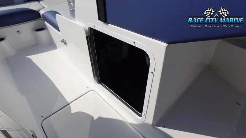 Slide: The Image of 2015 MasterCraft X55 boat interior with open storage compartment. - 33
