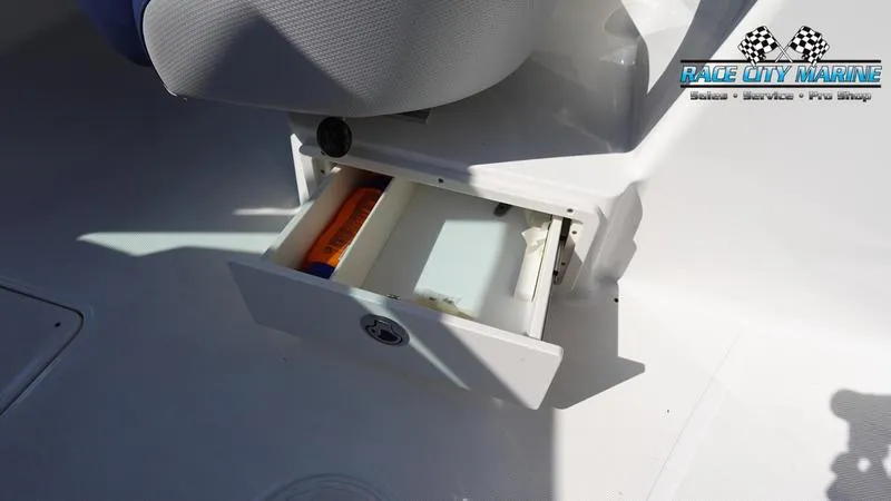 Slide: The Image of Open storage compartment in 2015 MasterCraft X55 boat interior. - 38