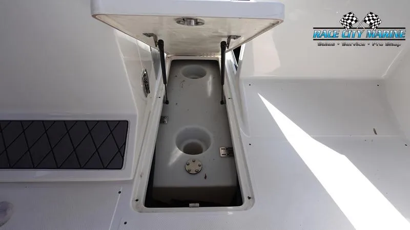 Slide: The Image of 2015 MasterCraft X55 storage compartment with Race City Marine logo. - 44