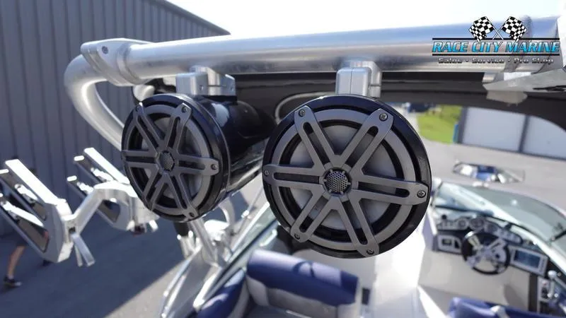 Slide: The Image of 2015 MasterCraft X55 boat with mounted speakers and Race City Marine logo. - 47