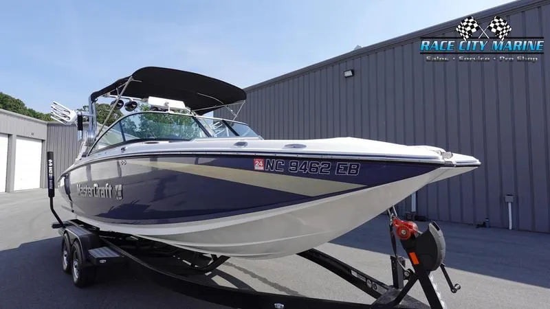 Slide: The Image of 2015 MasterCraft X55 boat at Race City Marine dealership. - 5